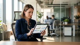 Executive analyzing AI automation financial data on tablet