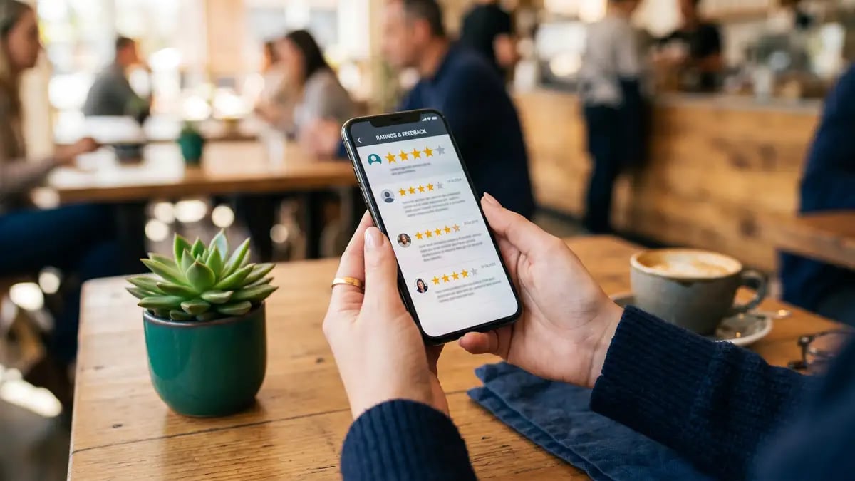 Reviews and testimonials on a phone, a trust source AI engines read